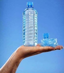 close up of man holding full plastic water bottle 28243