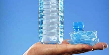 close up of man holding full plastic water bottle 28243 close up of man holding full plastic water bottle 28243